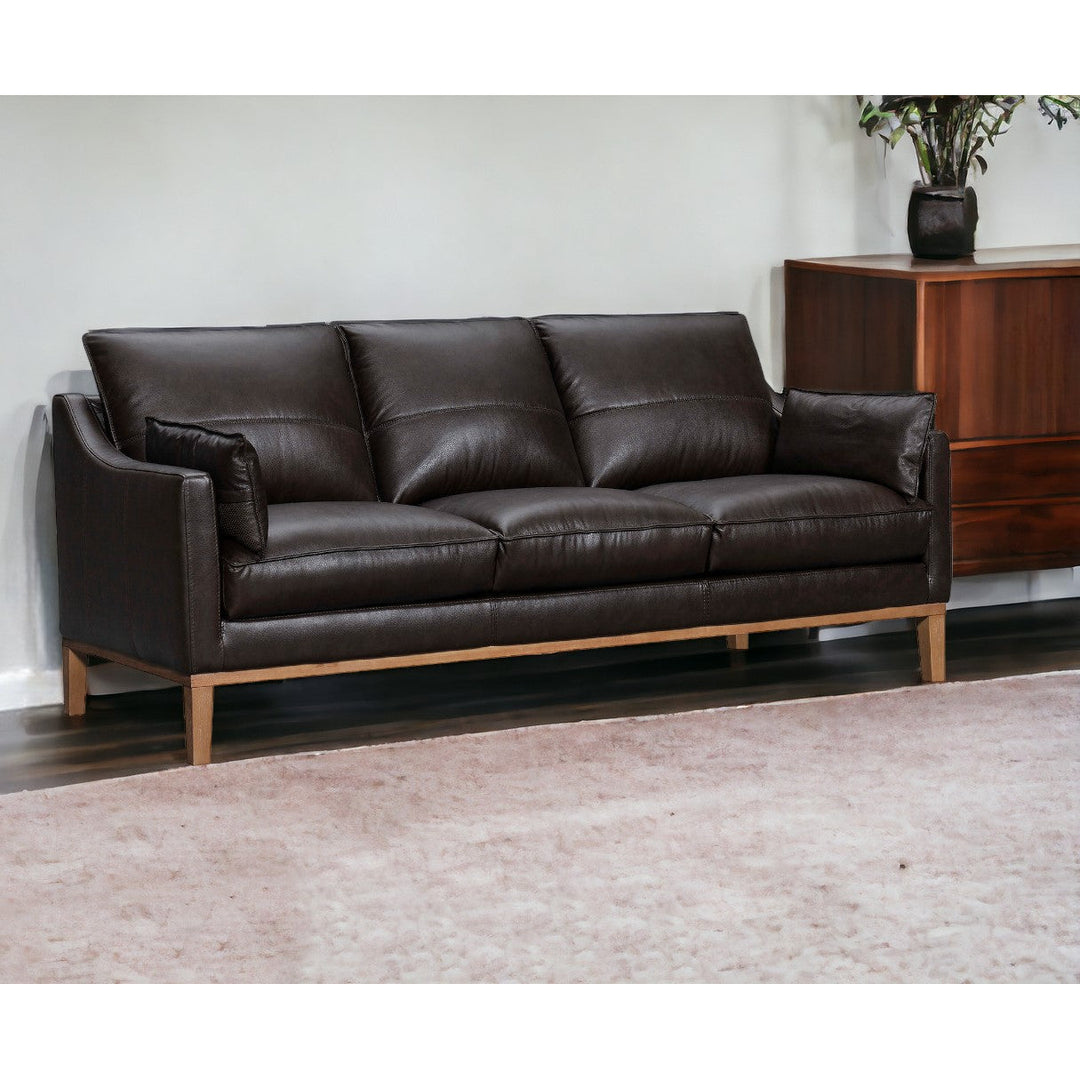 87" Dark Brown Leather Sofa And Toss Pillows With Brown Legs Image 11