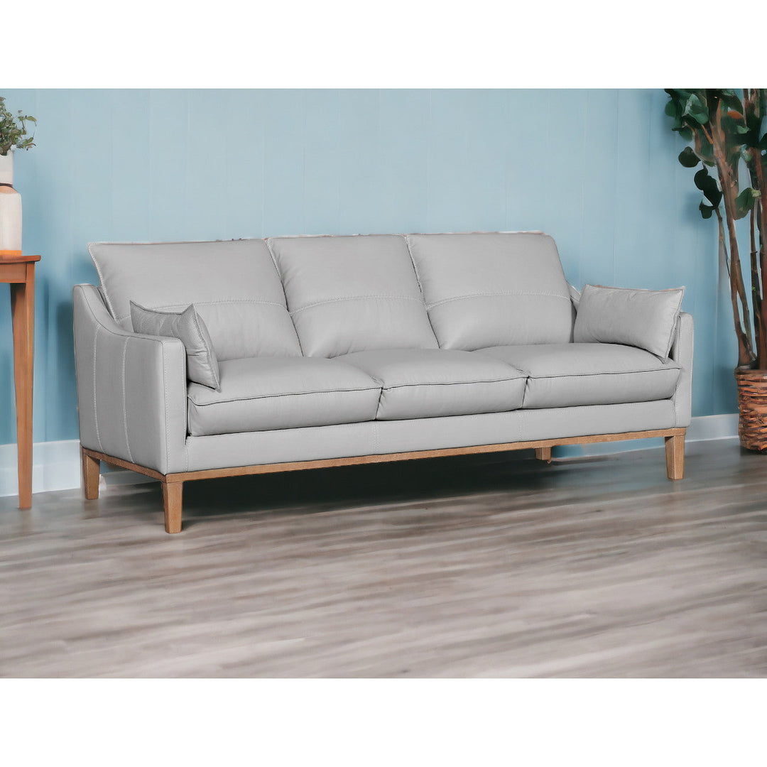 87" Gray Leather Sofa And Toss Pillows With Brown Legs Image 10