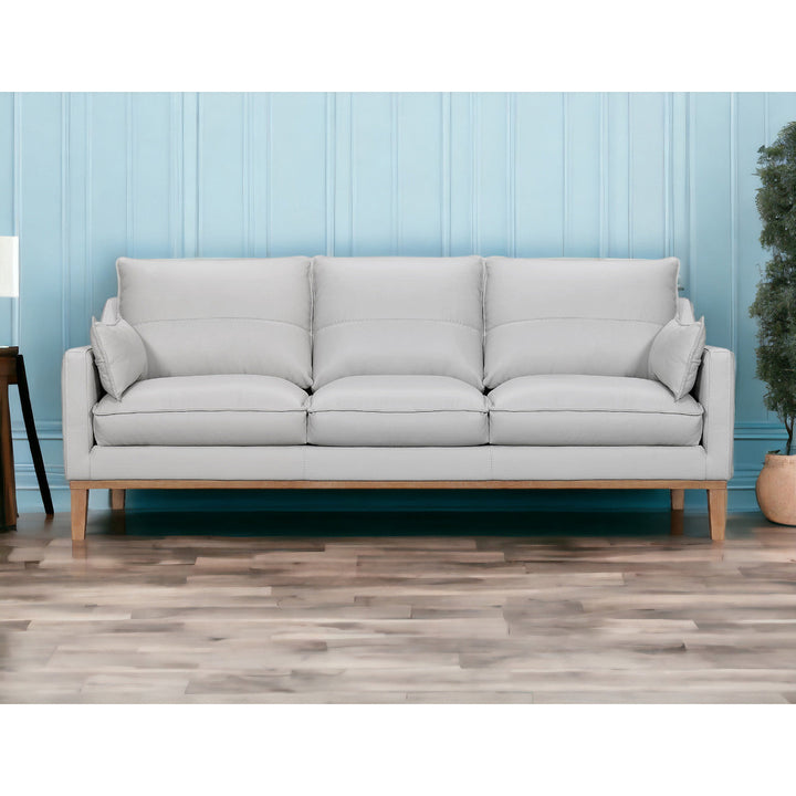 87" Gray Leather Sofa And Toss Pillows With Brown Legs Image 11