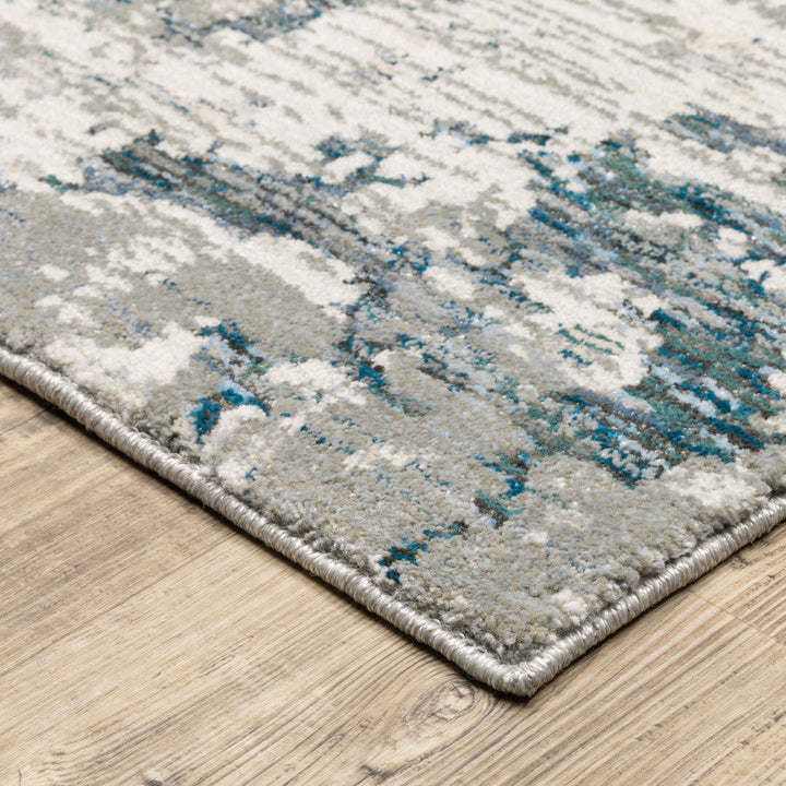 7 x 10 Blue and Beige Abstract Power Loom Area Rug Image 2