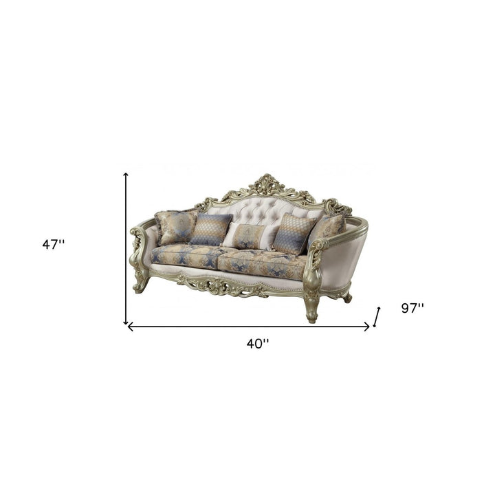 40" Antiqued White Velvet Curved Floral Sofa And Toss Pillows With Champagne Legs Image 3