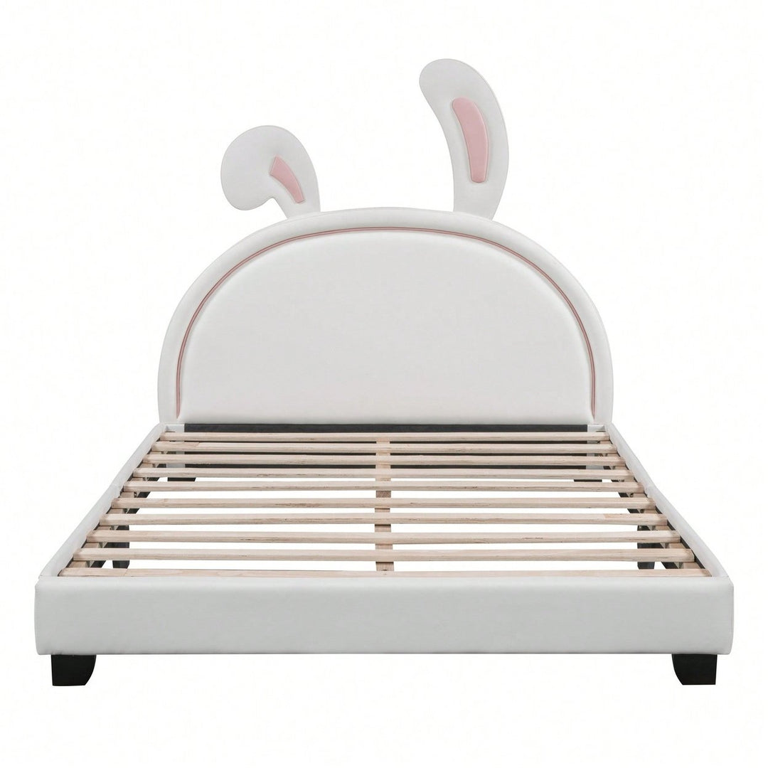 Elegant White Upholstered Leather Platform Bed With Rabbit Accent Image 1